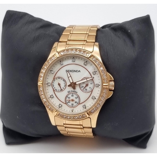 540 - A Sekonda Rose-Gold Plated Ladies Quartz Watch. Case - 35mm. White dial with three sub dials. White ... 