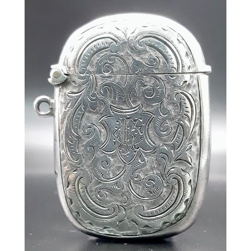 513 - An Antique Silver Engraved Vesta Case. Hallmarks for Birmingham 1918. Makers mark of Thomas Hayes. 
... 