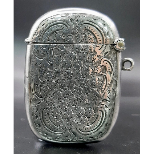 513 - An Antique Silver Engraved Vesta Case. Hallmarks for Birmingham 1918. Makers mark of Thomas Hayes. 
... 