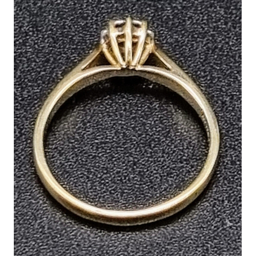 71 - A 9K Yellow Gold Diamond Ring. Four small diamonds.
Size O. 2.16g total weight.