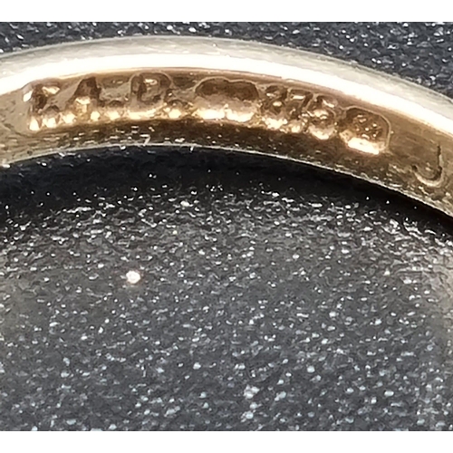 71 - A 9K Yellow Gold Diamond Ring. Four small diamonds.
Size O. 2.16g total weight.