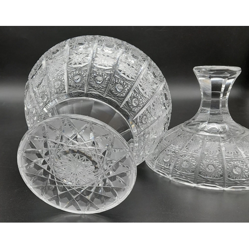 1008 - A beautiful circular crystal bowl with lid, stands 23cms tall