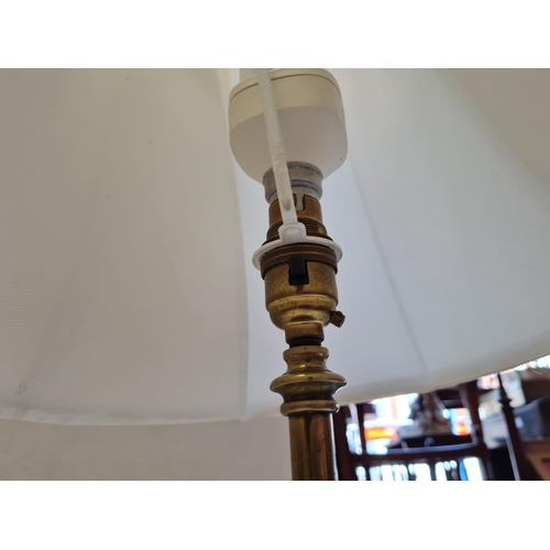 1015 - Stylish looking table lamp, Gold colouring to base with cream shade. Stands 60cm in height. Full wor... 