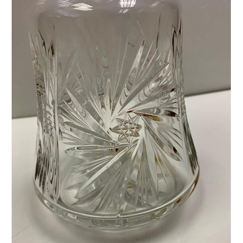 1029 - Antique cut glass decanter with wide base, star spiral design on side. Width 13.5cm, Height 30cm.