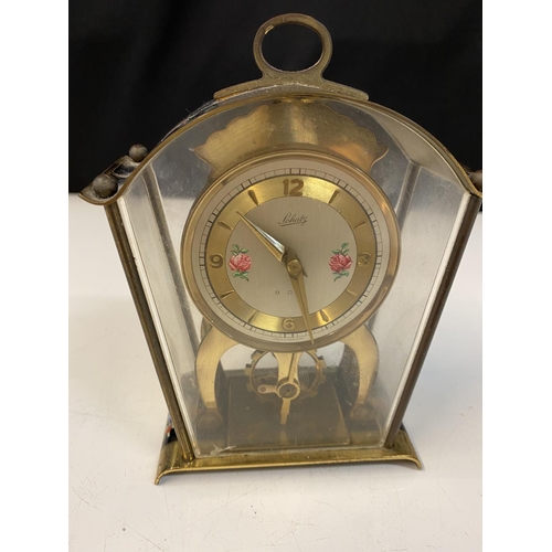 1050 - Schatz Sohne #59 German 8-Day Brass Skeleton Carriage Clock. With floral numeral dial, open escapeme... 