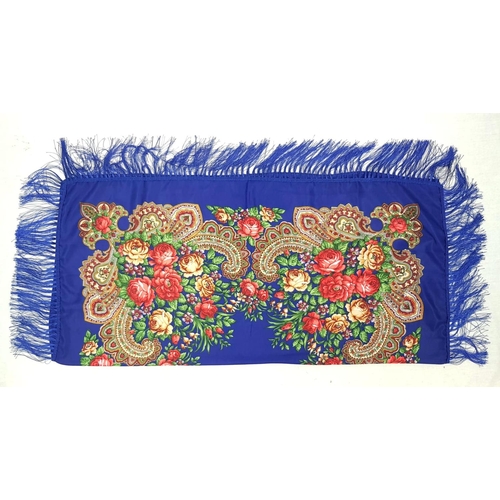 1064 - A blue floral piano square shawl with tasselled edging. 110cm x 100cm