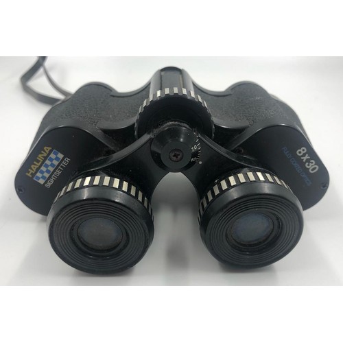 1070 - 2 x pairs of BINOCULARS. A pair of Prinz, 10 x 50 coated optics with case and a smaller pair of
Hali... 