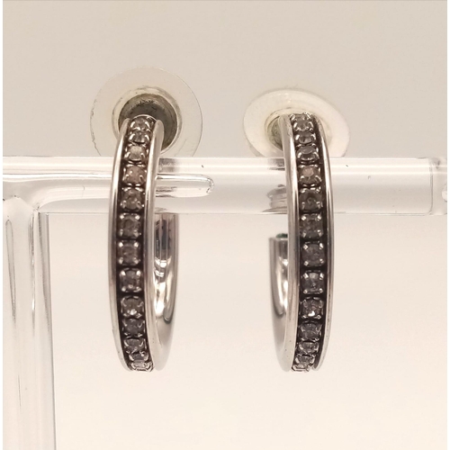 1078 - Three pairs of sterling silver earrings , one with cubic zirconia. Average diameter: 2-2.5 cm. total... 