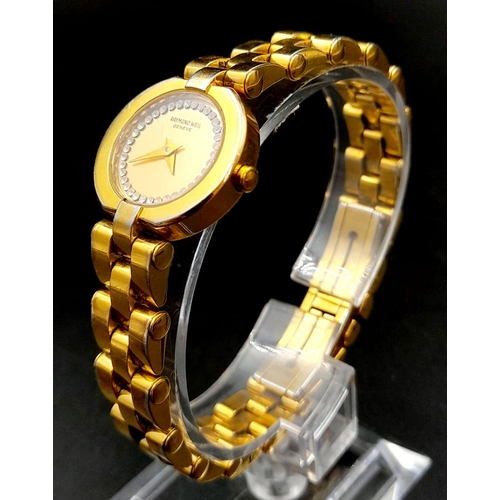 391 - A Raymond Weil Gold Plated Quartz Ladies Watch. 
Case - 20mm. Gilded dial with white stones. In work... 