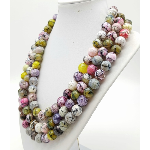 143 - An Exotic Three-Row 1400ct Dragons Vein Multi-Coloured Agate Bead Necklace. 12mm Beads.
40-48cm.