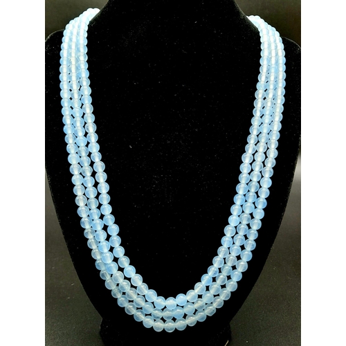 399 - A 700Ct Earth-Mined Pale Blue Chalcedony Three-Strand Beaded Necklace. 6mm beads. 46-50cm.