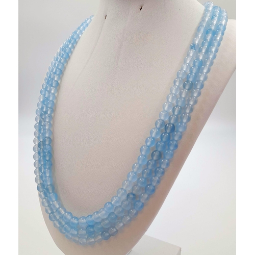 399 - A 700Ct Earth-Mined Pale Blue Chalcedony Three-Strand Beaded Necklace. 6mm beads. 46-50cm.