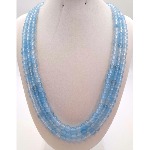 399 - A 700Ct Earth-Mined Pale Blue Chalcedony Three-Strand Beaded Necklace. 6mm beads. 46-50cm.