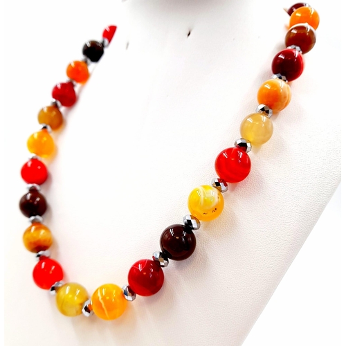 440 - An Autumn-Fire Agate Bead Necklace. 925 silver clasp.
12mm beads. 44cm.