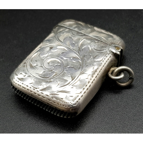 79 - An Antique Silver Vesta Case. Hallmarks for Birmingham 1899. Makers mark of T.H. Hazelwood. 3 x 4cm