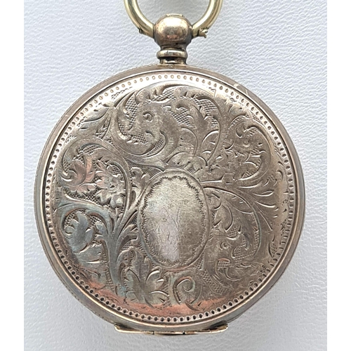 387 - A Silver (800) Antique Miniature Pocket watch with Fob and Key. A/F. 49.2g total weight.