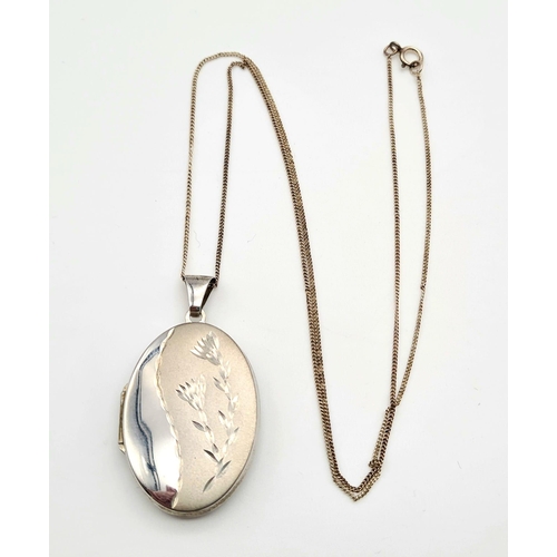 480 - Two Silver Oval Lockets on Silver Necklaces. Note: If you have a friend named David and he is about ... 