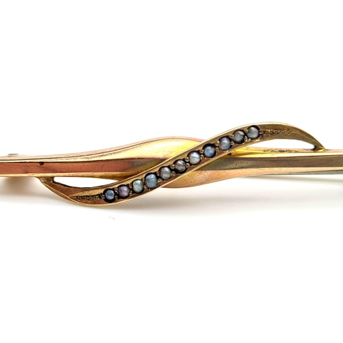 482 - A Vintage 9K Yellow Gold and Seed Pearl Brooch with white metal pin. 1.45g total weight. 5cm