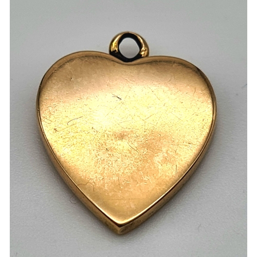 483 - A 9K Yellow Gold Ruby Heart Pendant. 18mm. 1.52g