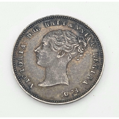 313 - An 1878 Silver Four Pence Coin. Near Uncirculated. Obverse - Bare head of Queen Victoria facing left... 