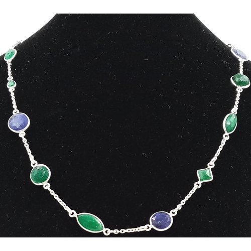 732 - A 17g Emerald and Blue Sapphire Gemstone long chain necklace set in 925 silver. 68cm.