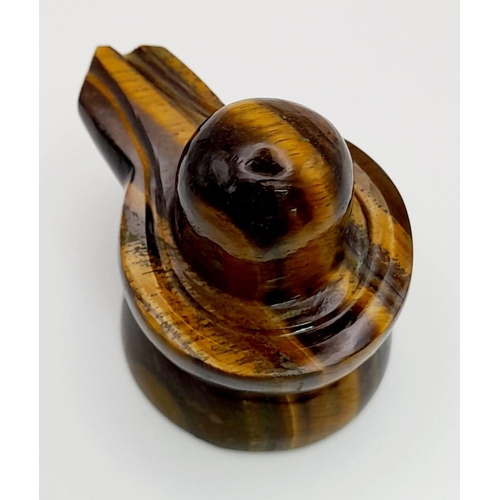 850 - A 71g Tigers Eye Carved Shivling Statue. 4.5cm