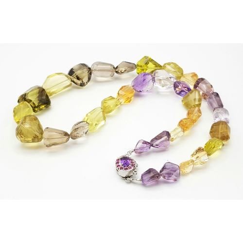 626 - 550ct Citrine and Amethyst Tumble bead necklace with Ruby clasp in 925 Silver. 52cm