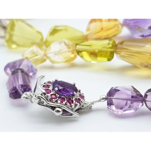 626 - 550ct Citrine and Amethyst Tumble bead necklace with Ruby clasp in 925 Silver. 52cm