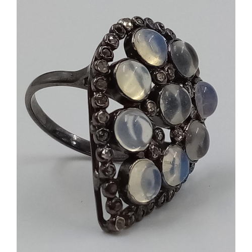 866 - An Opal and Diamond Ring in Sterling silver with a black antique finish. Opal 5.10cts, diamonds 1.15... 