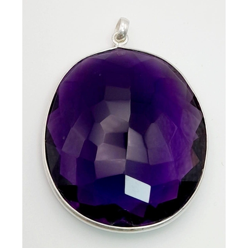 871 - A 105ct Hydro Amethyst Gemstone Pendant in a bezel setting, 925 silver. 40mm x 37mm. Comes with a di... 