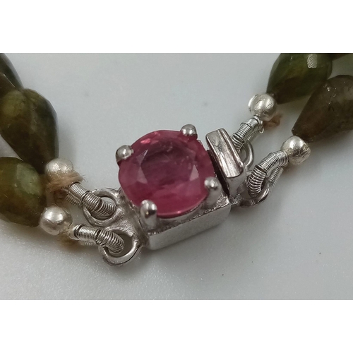 960 - A 168ct Fancy Tourmaline Drop shape beads necklace with Ruby Clasp in 925 Silver. 44cm.