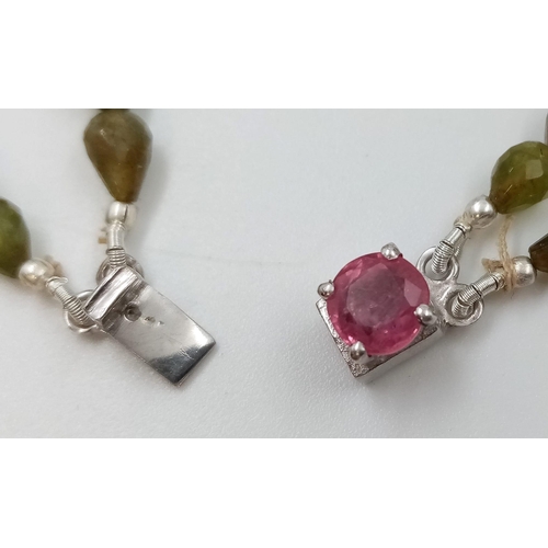 960 - A 168ct Fancy Tourmaline Drop shape beads necklace with Ruby Clasp in 925 Silver. 44cm.