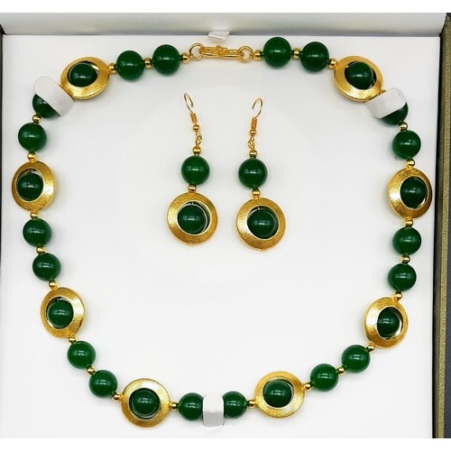 141 - A 60’s style green jade with gilded accents necklace and earrings set in a presentation box. Necklac... 