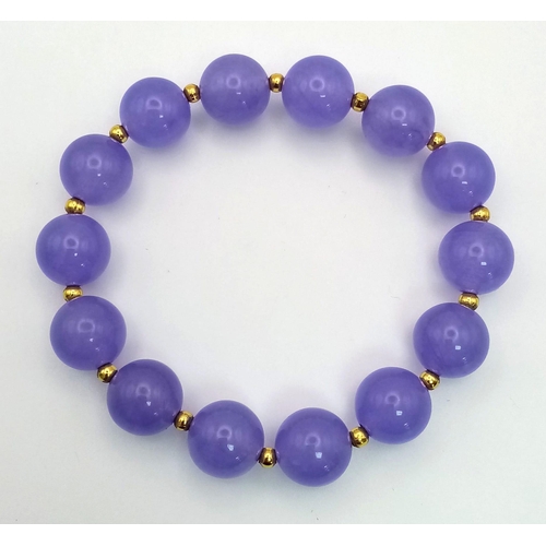 1097 - A Lavender Jade Bead Bracelet with Gilded Spacers.
16cm.