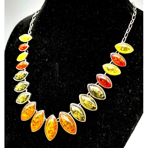 1174 - A Multi-Coloured Resin Necklace set in White Metal.
46cm.