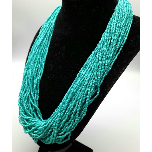 900 - A 50 Strand Small Bead Turquoise Necklace. 56cm