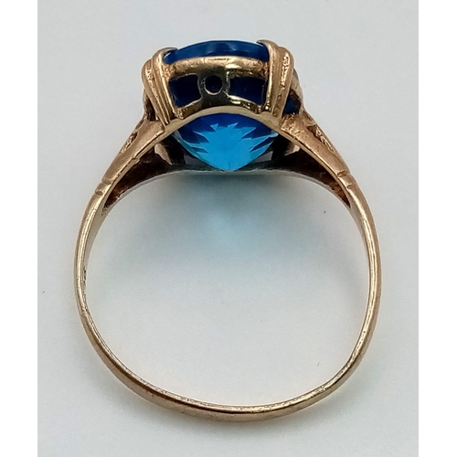 207 - A 9K Yellow Gold Bright London-Blue Topaz Ring. 6ct topaz. Size O. 2.84g total weight.