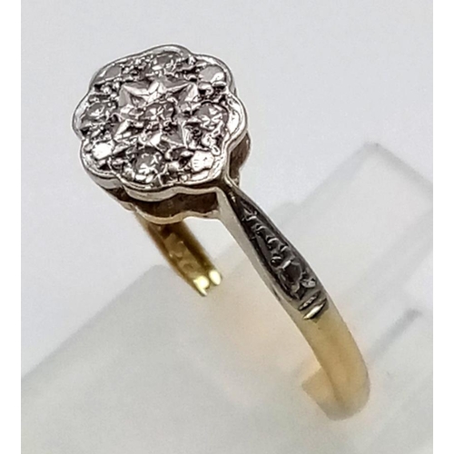 214 - An 18K Yellow Gold Diamond Daisy Ring. Five diamonds.
Size L. 3.1g.