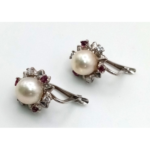 228 - A Pair of Natural South Sea Pearl Diamond and Ruby Earrings. 4.9g total weight.