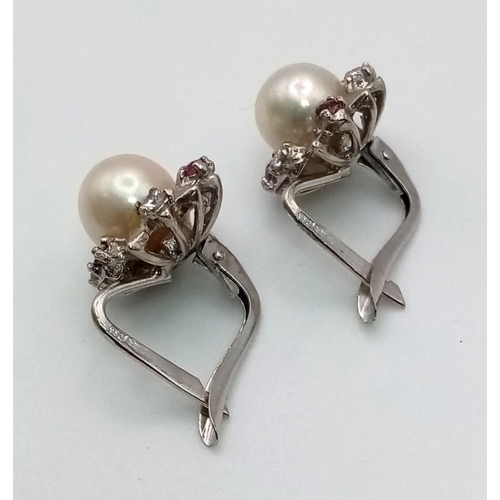 228 - A Pair of Natural South Sea Pearl Diamond and Ruby Earrings. 4.9g total weight.