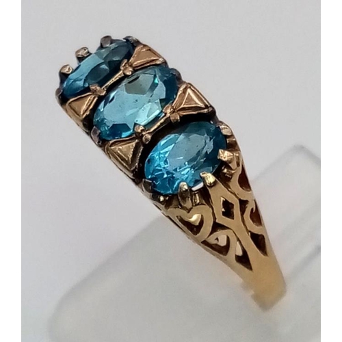 398 - A 9K Yellow Gold Three-Stone Topaz Ring. Size O. 3.08g total weight.