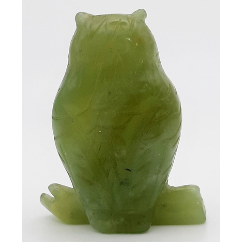 781 - Petite carved jade owl figurine with striking yellow eyes. Stands 5cm in height, total weight 35 gra... 