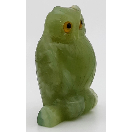 781 - Petite carved jade owl figurine with striking yellow eyes. Stands 5cm in height, total weight 35 gra... 