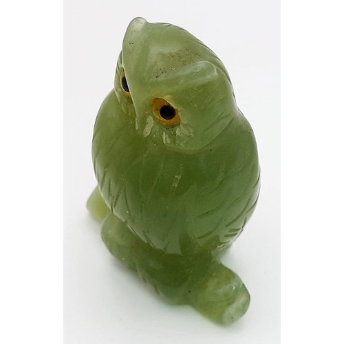 781 - Petite carved jade owl figurine with striking yellow eyes. Stands 5cm in height, total weight 35 gra... 