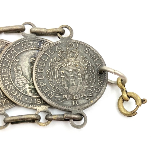 1149 - A Vintage Republic of San Marino Coin Bracelet. 
15 coins. 18cm. 45g.