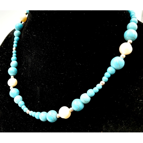 1163 - A Cultured Freshwater Pearl and Graduated Turquoise Howlite Necklace. 38cm.