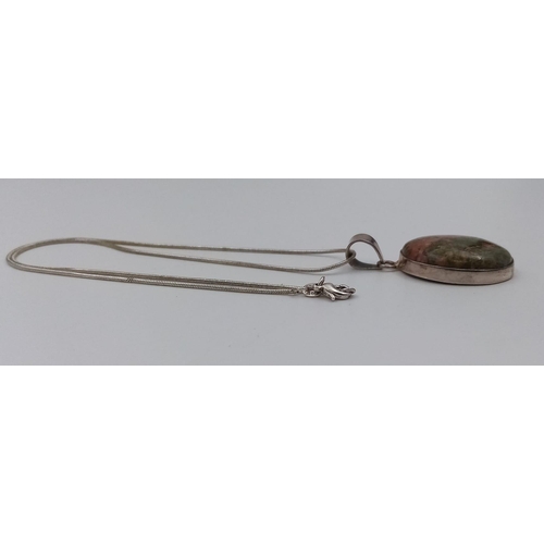 1016 - A 925 Silver and Unakite Pendant on a Silver Chain. 44cm and 3cm.