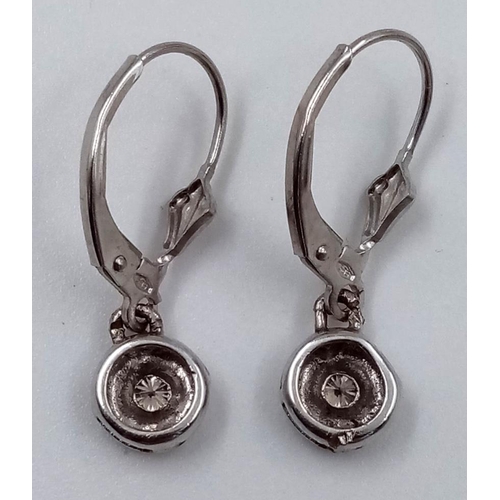 885 - A Pair of 14K White Gold Diamond Clasp Back Earrings. 1.92g total weight.