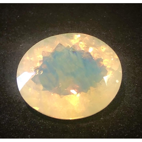 1166 - A 36ct Glimmering Fire Opal. Oval cut. 26 x 21 x13mm.