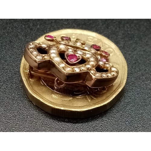 1173 - A REGAL STYLE GOLD , BURMESE RUBY AND PEARL BROOCH POSSIBLY RUSSIAN . 2.58gms (one stone missing)